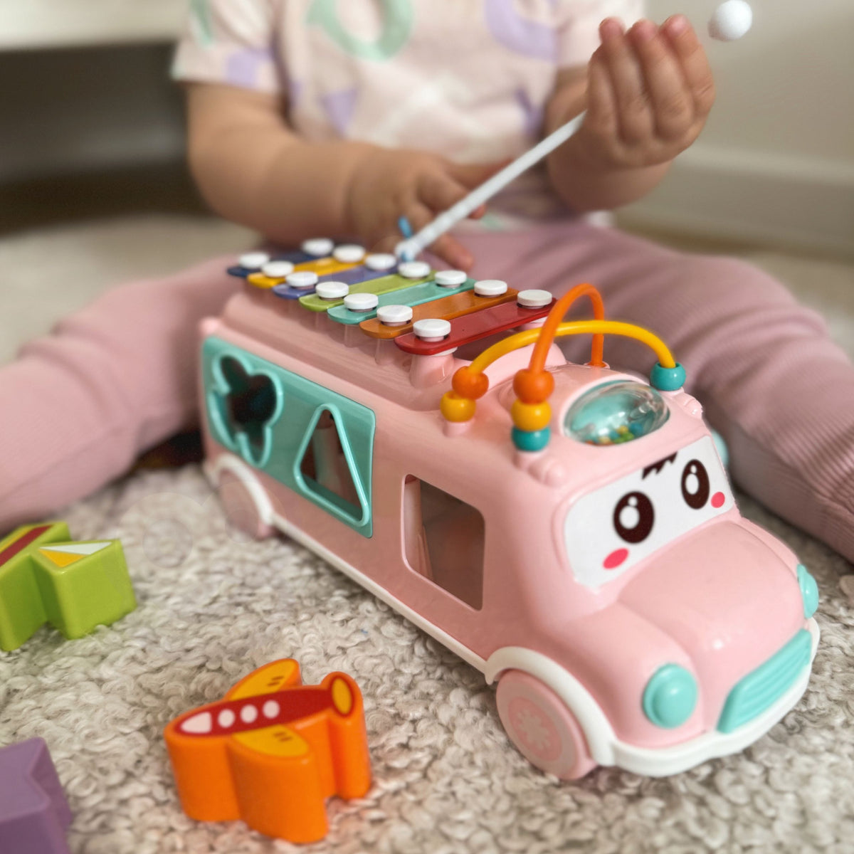WOOPIE BABY Muzikinė mašinėlė rūšiuoklė su cimbolais, rožinė