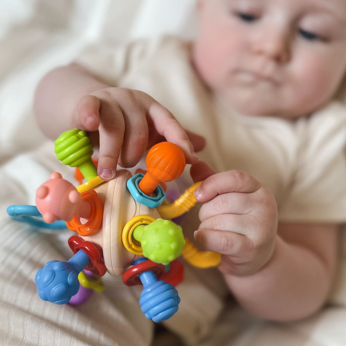 WOOPIE BABY minkštas barškutis-kramtukas 2in1 kūdikiams 0m+