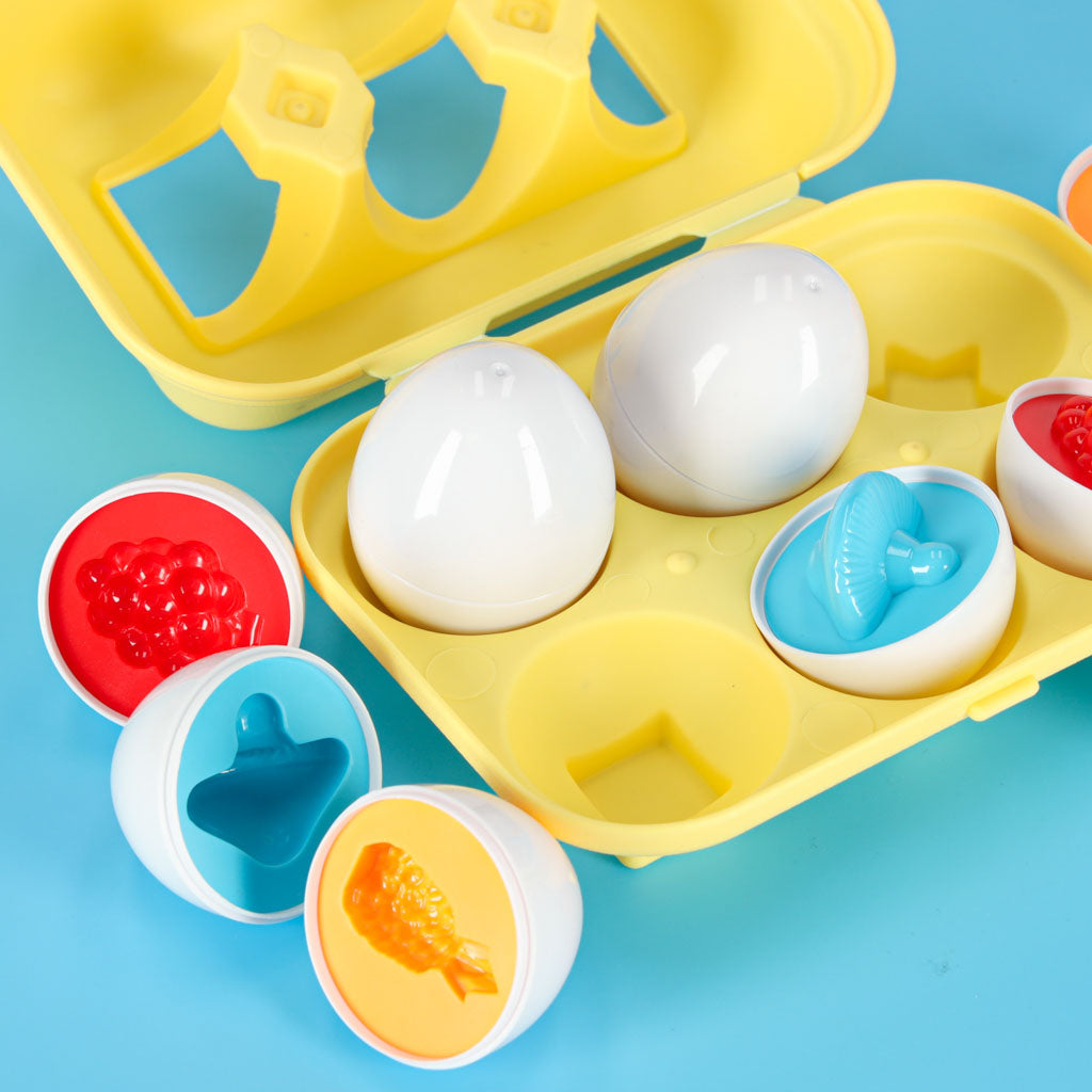 Edukacinis formų rūšiuoklis kiaušiniai „Montessori“ su vaisiais ir daržovėmis, 6 vnt.