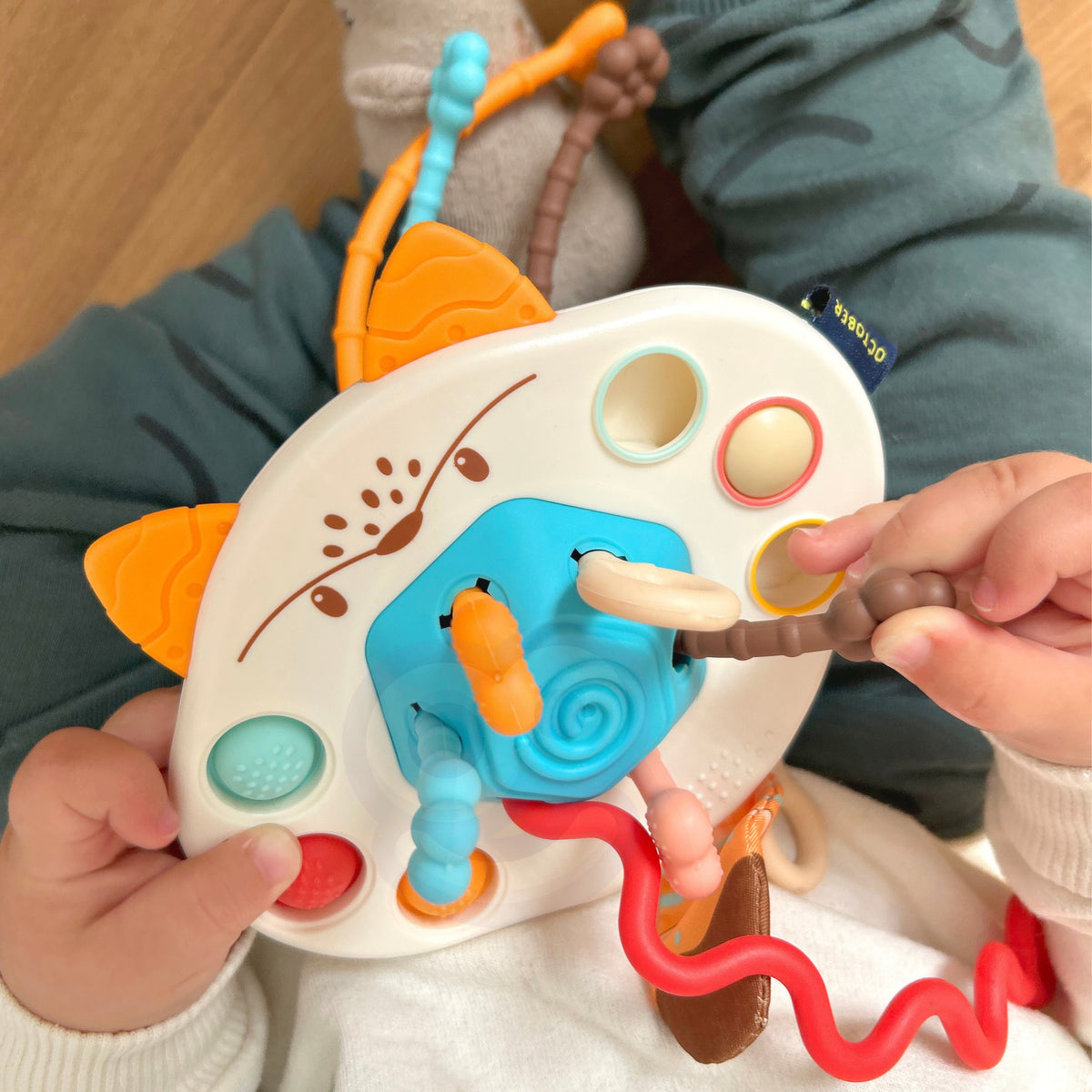 WOOPIE BABY Montessori Sensorinė Lapė – Kramtukas ir Barškutis