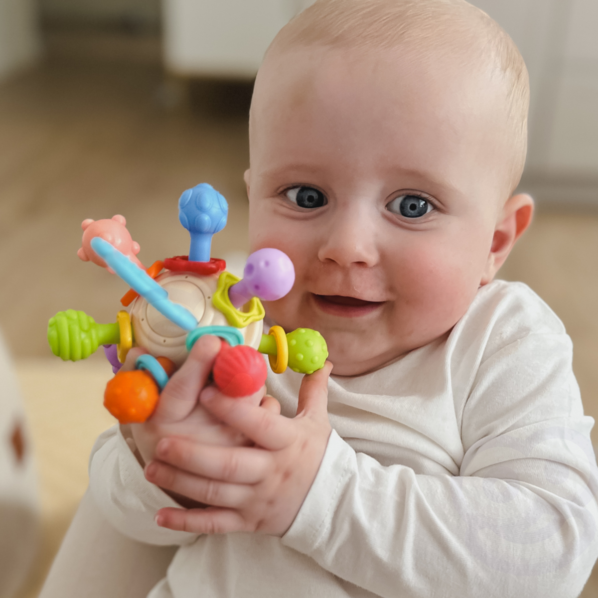 WOOPIE BABY minkštas barškutis-kramtukas 2in1 kūdikiams 0m+