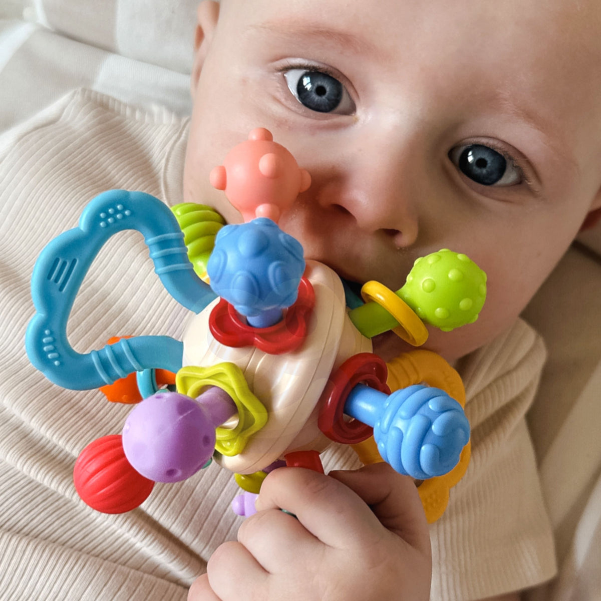 WOOPIE BABY minkštas barškutis-kramtukas 2in1 kūdikiams 0m+