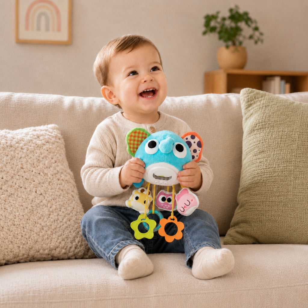 Pliušinis muzikinis drambliukas su kramtukais Woopie Baby